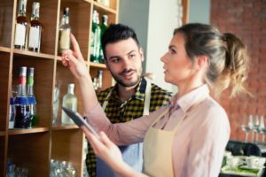 waitress doing bar inventory