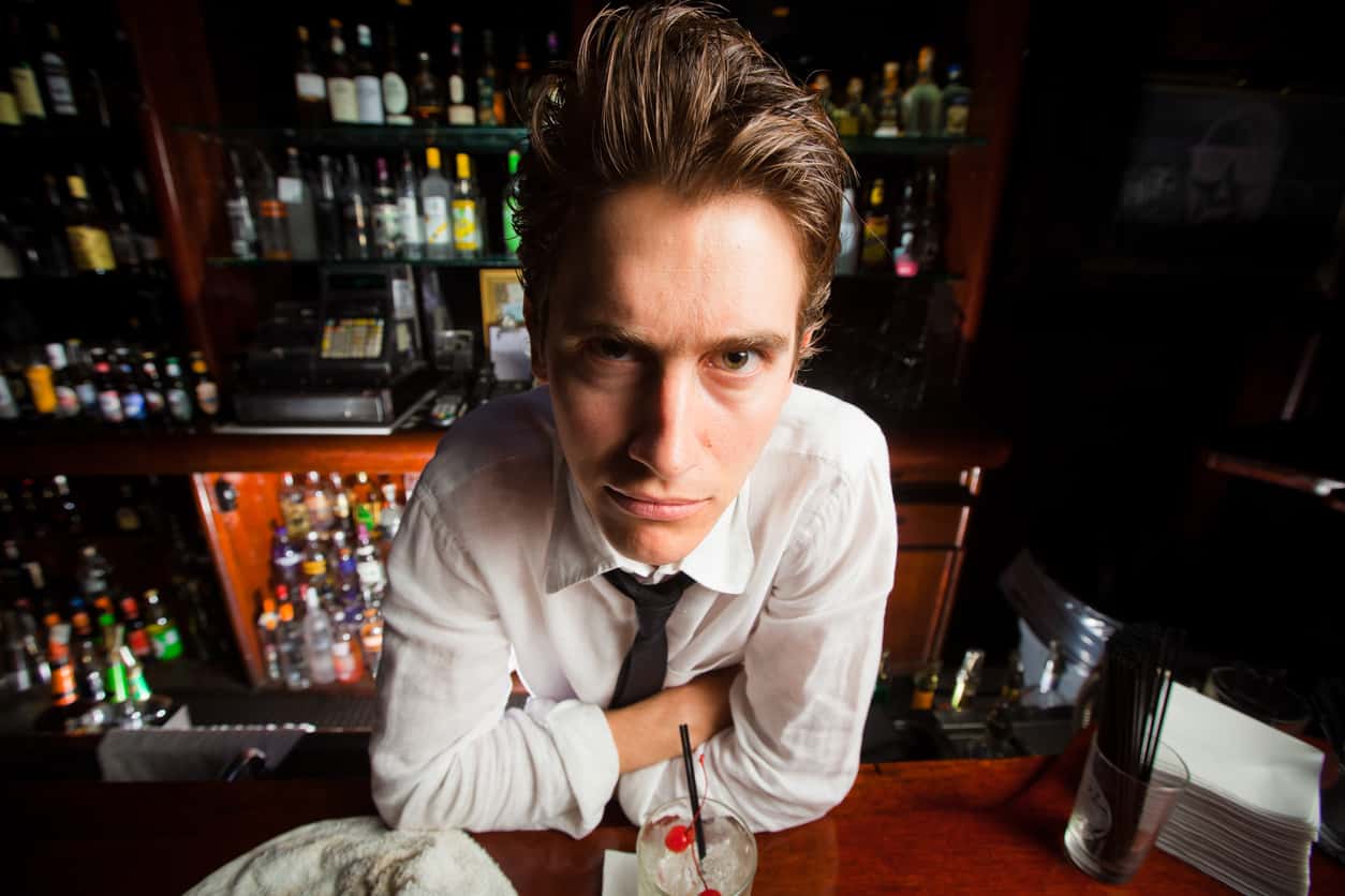 Wide-angle shot of a crazy-looking bartender